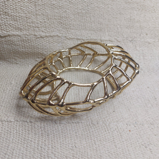 Macro filigree chunky golden bangle handsculpted for ROKUS by Marie-Paule Tano. Made in bronze. 